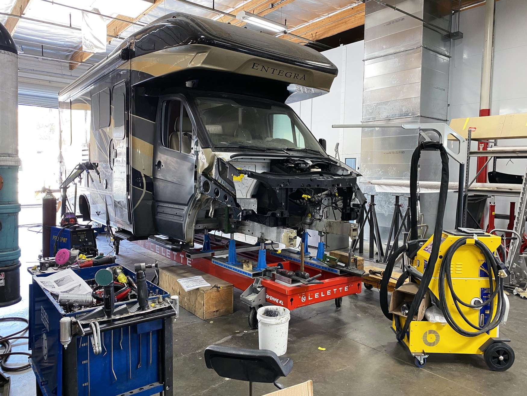 Coach positioned on a frame rack for structural measurement