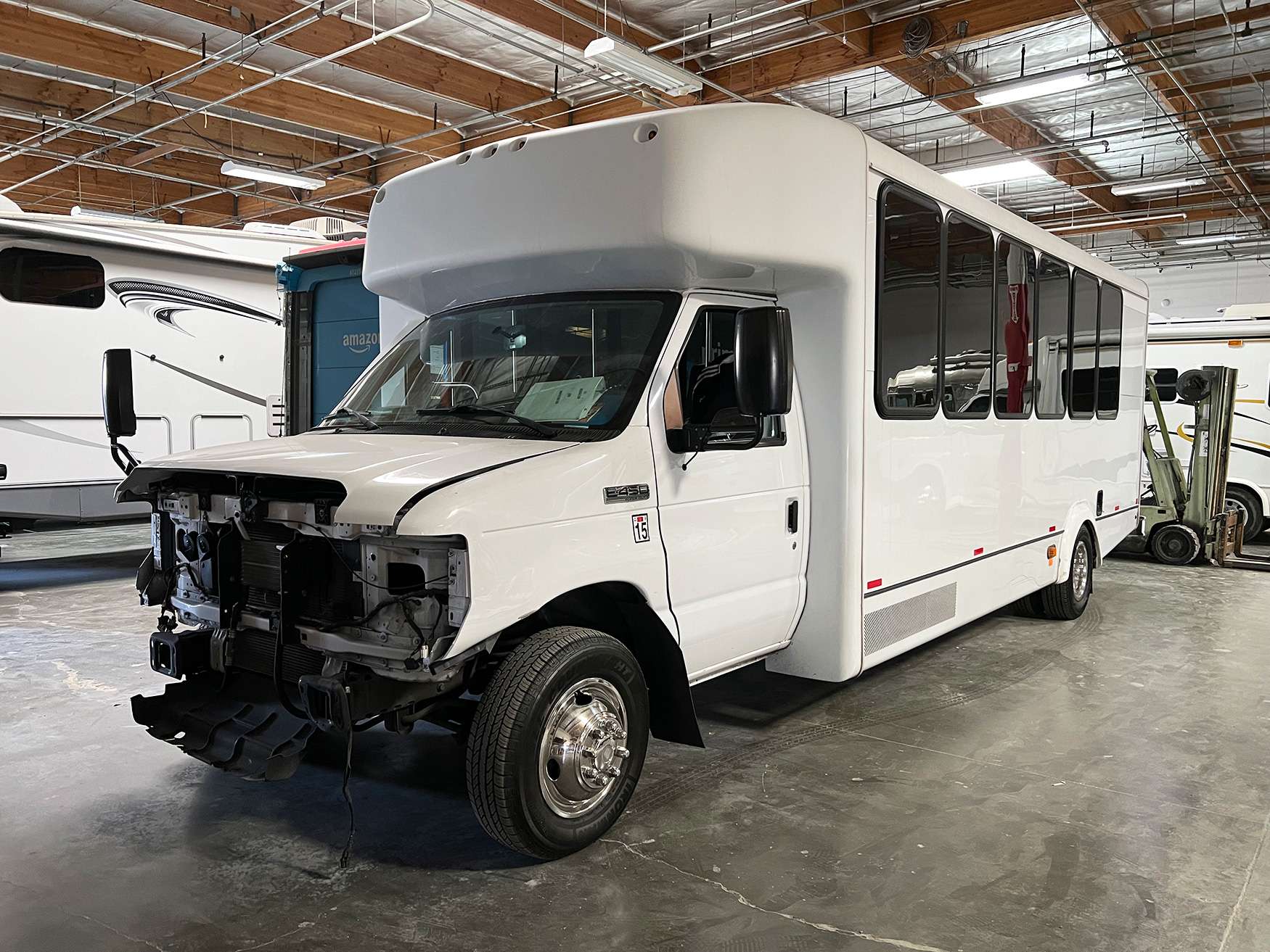 Transit bus positioned for structural inspection