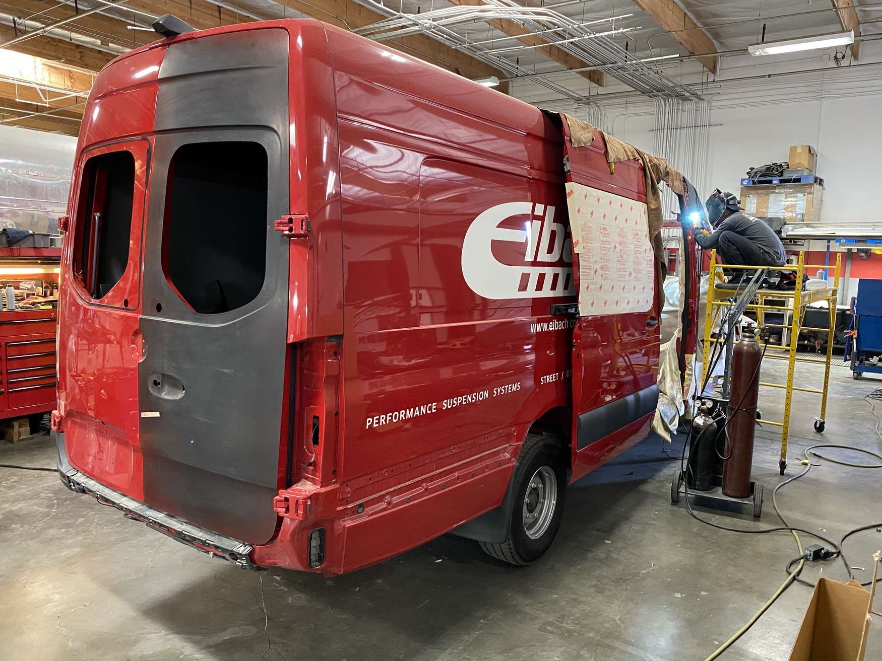 Sprinter van in a body repair bay